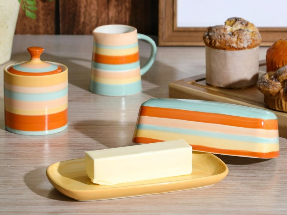 orange, white and blue striped butter dish, creamer and sugar bowls