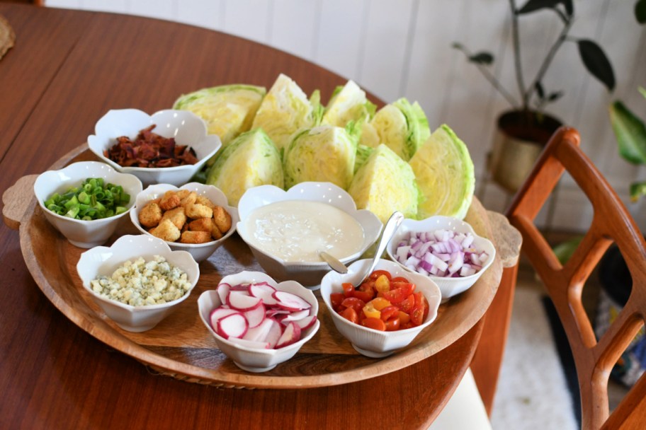 wedge salad board with toppings on a table