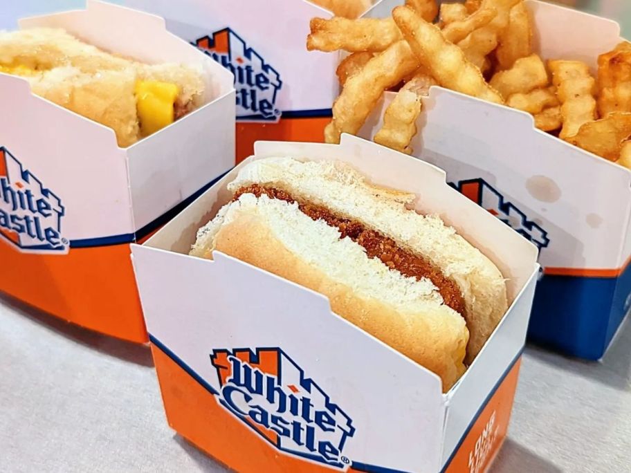 white castle burgers and fries in boxes on table