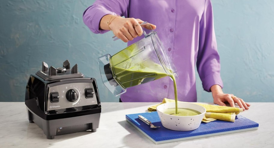 woman pouring soup into bowl