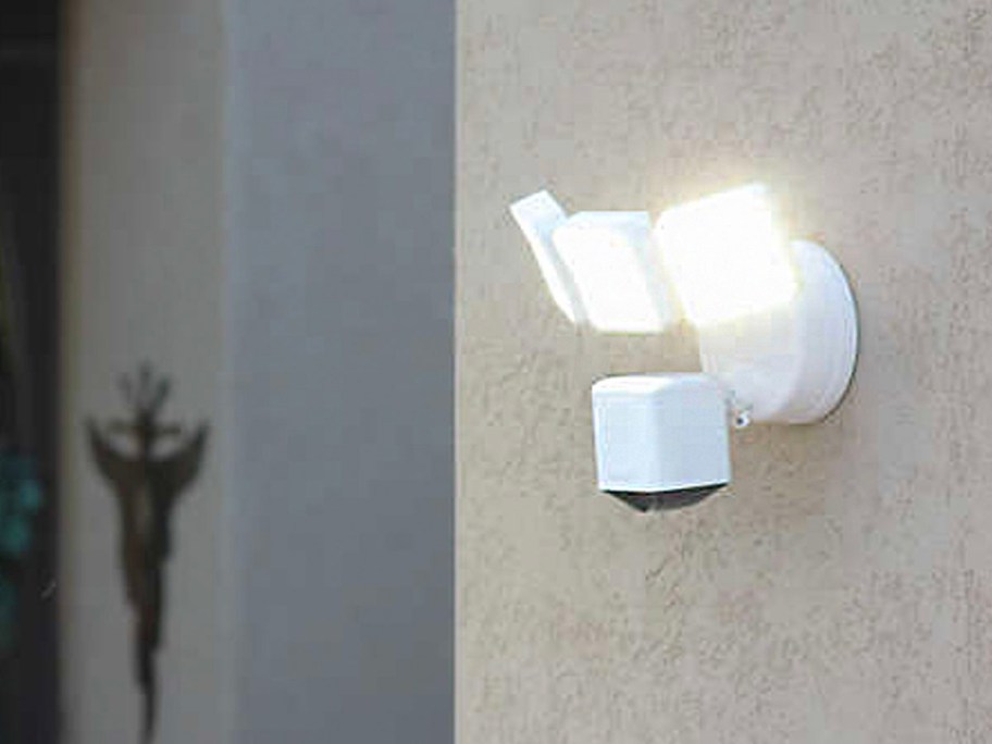 white floodlight hanging on wall