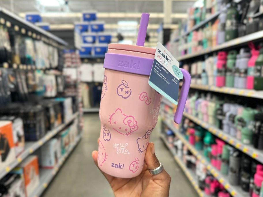 Zak Designs Hello Kitty Kids Straw Handle 18oz Tumbler being held by hand in aisle in store