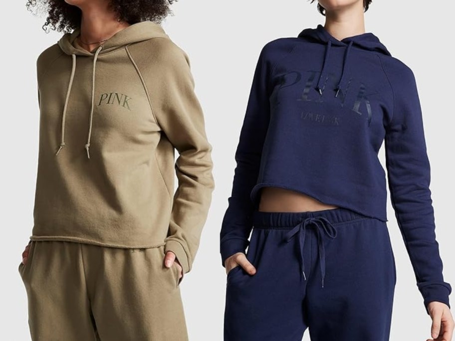 2 women wearing Victoria's Secret PINK Cropped Hoodies, 1 in olive green, 1 in navy blue