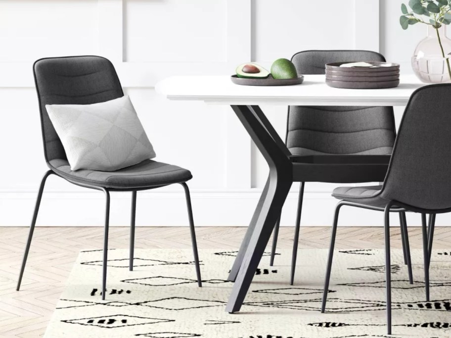 grey dining chairs around a modern dining room table