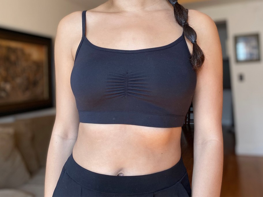 woman wearing black bralette