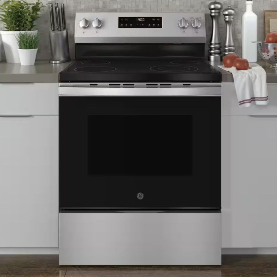 a stainless steel and black kitchen range in a kitchen