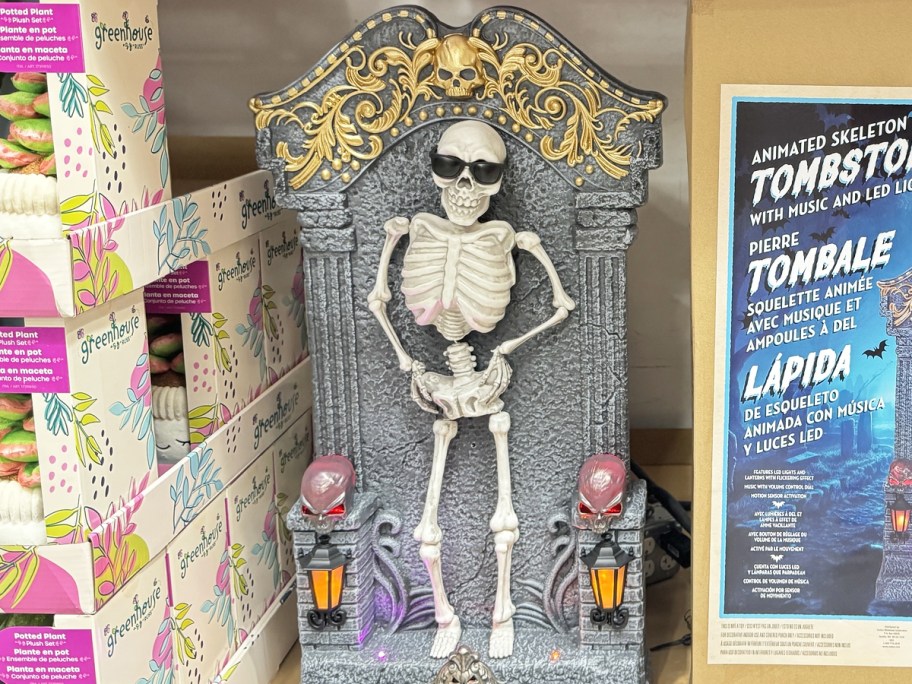 animated skeleton tombstone decoration in display in store