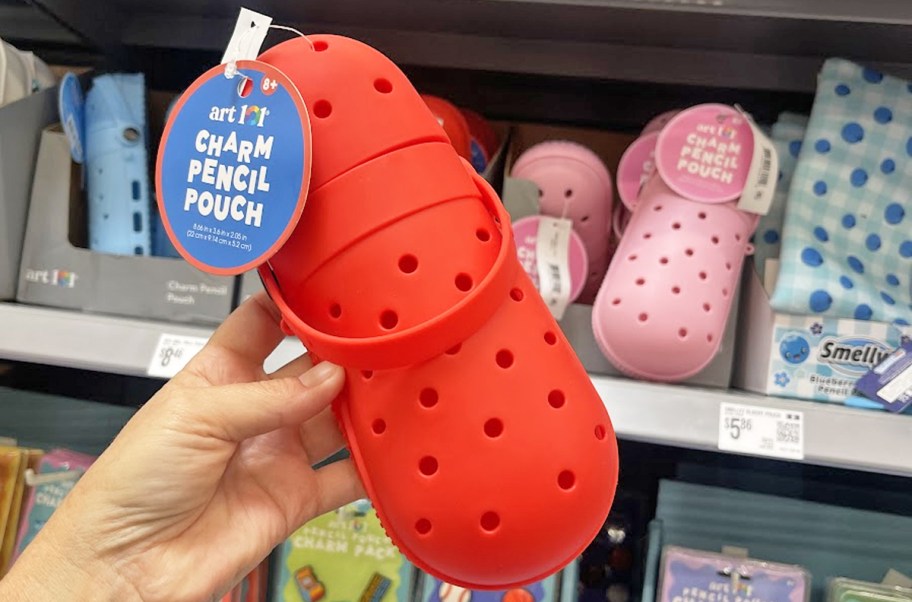 hand holding up a red crocs-inspired pencil case