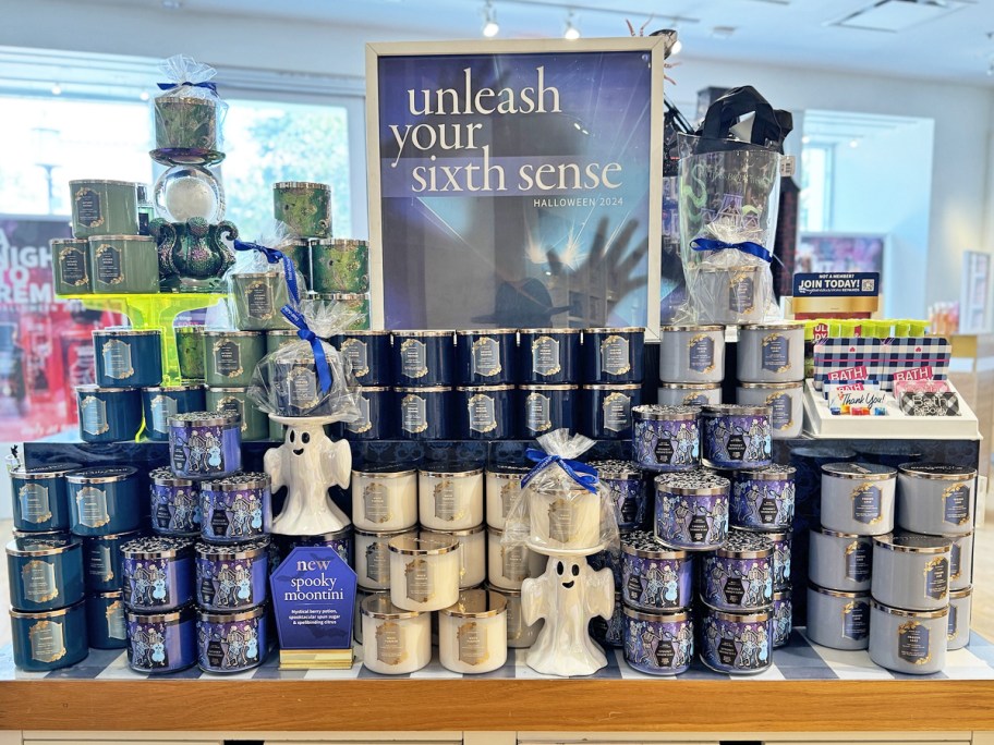 display of Halloween 3-wick candles in store