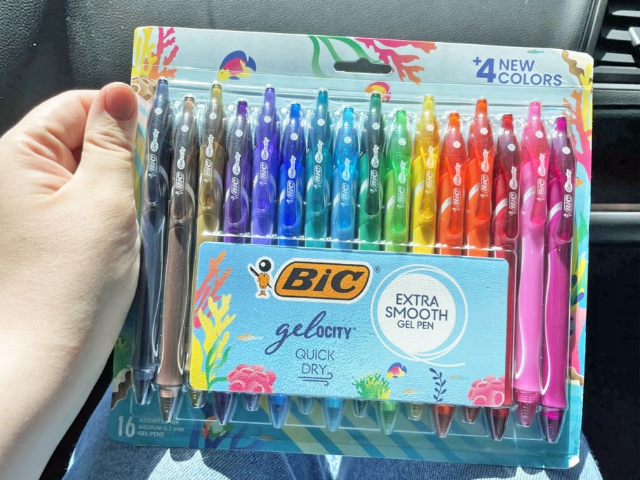 hand holding up a set of BIC Gelocity Quick-Dry Gel Pens