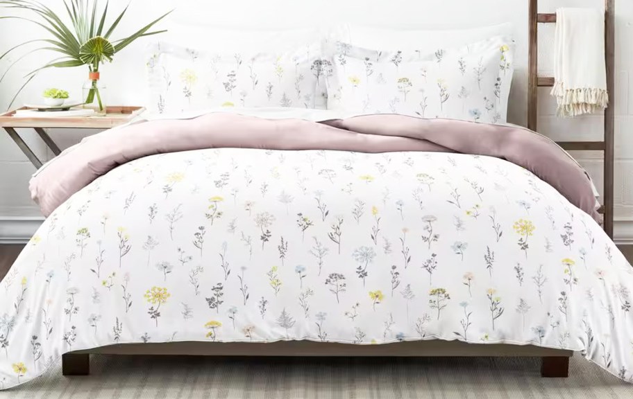 floral print comforter and shams set on a bed