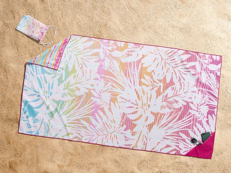 an oversized beach towel on the beach