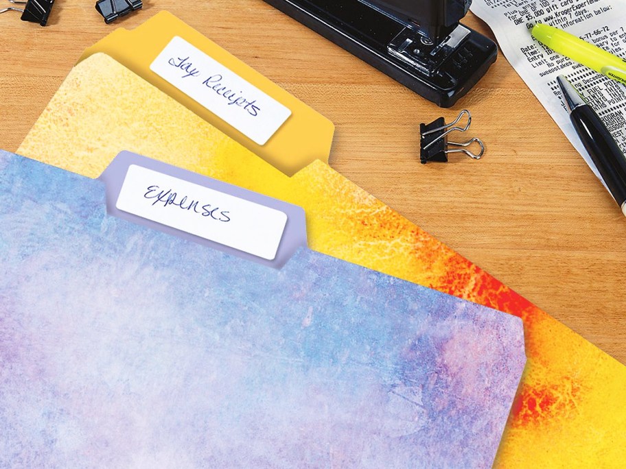 purple and yellow watercolor print file folders on desk