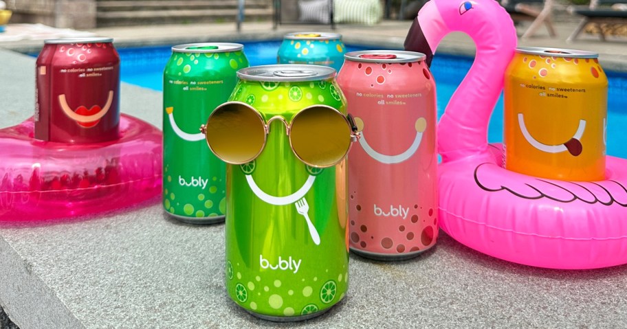 bubly sparkling water cans wearing sunglasses near pool