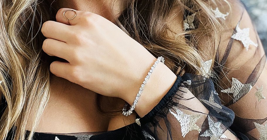 woman wearing a silver tennis bracelet