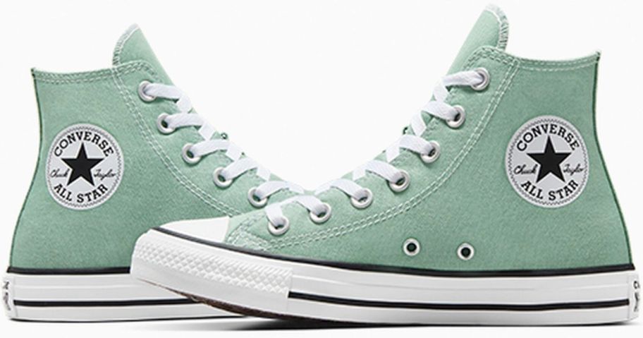A pair of green Chuck Taylor sneakers