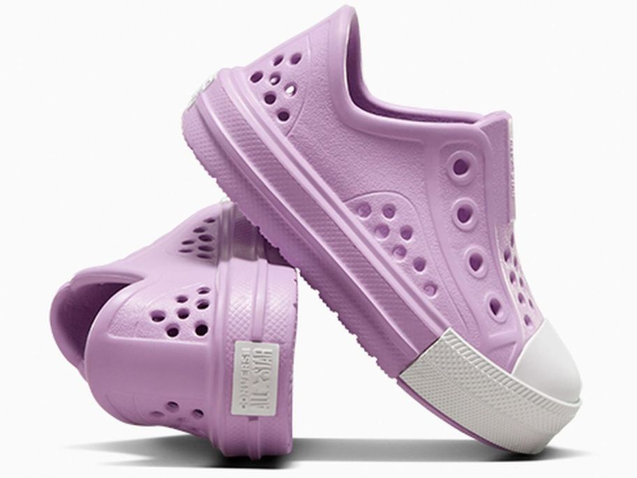 A pair of purple Chuck Taylor kids shoes