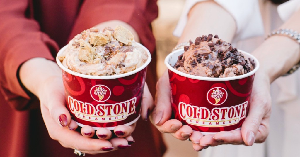 2 women holding up ice cream bowls from coldstone creamery