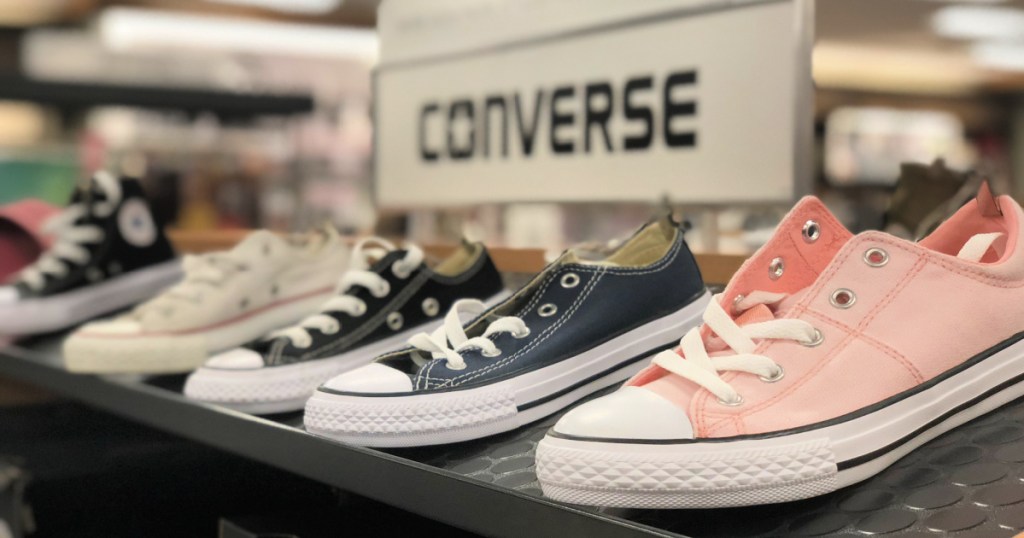 low top converse shoes on display in store