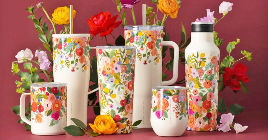 floral print tumblers and cups surrounded by flowers