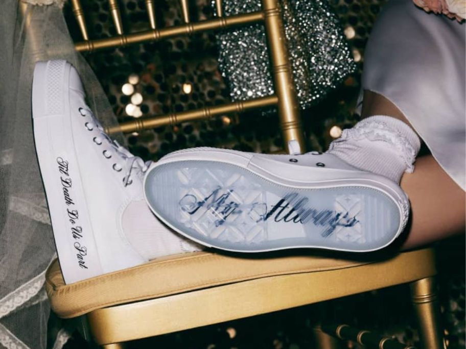 side and bottom view of white Converse Chuck taylors custom wedding shoes