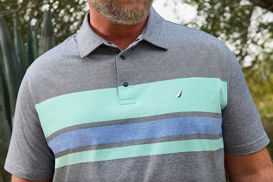 man in grey teal polo