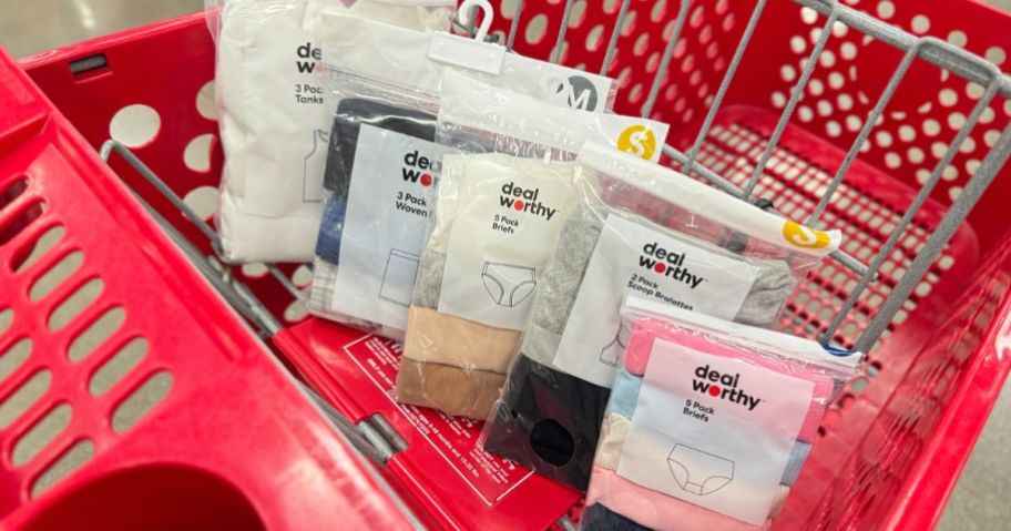 A target shopping cart with several packs Dealworthy undergarments in the front basket