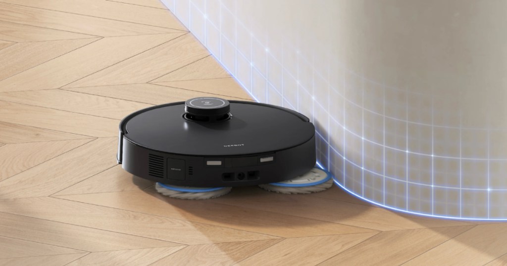 Ecovacs Deebot Robot Vacuum & Mop with mop pads cleaning around bar in kitchen
