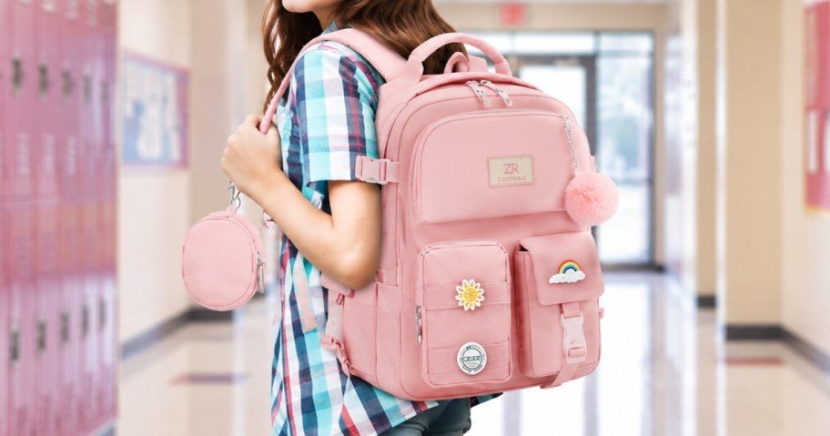a girl with a pink backpack on her back