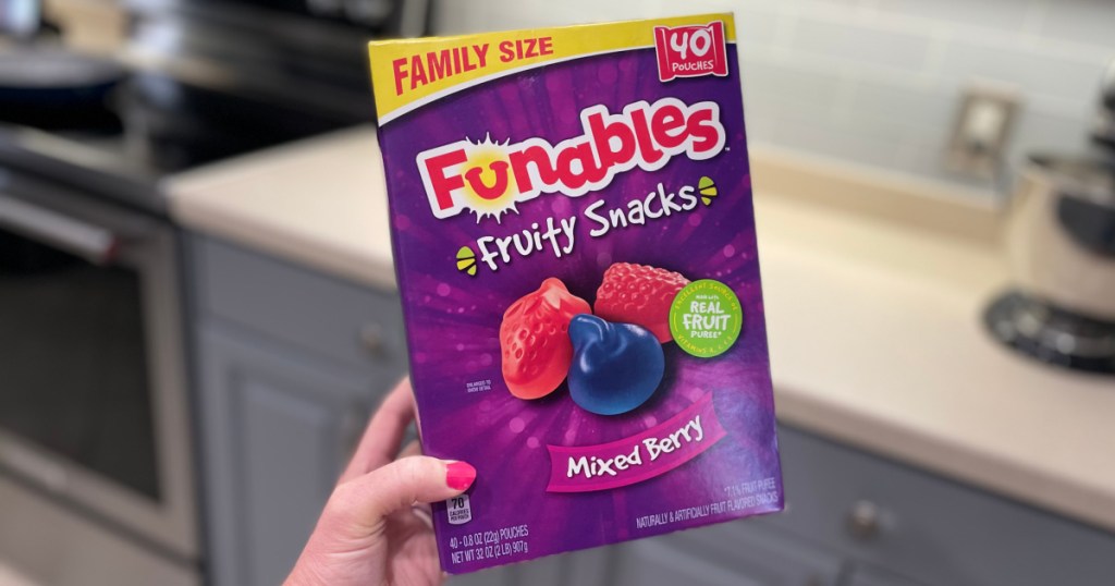 person holding 40 count box of funables fruit snacks