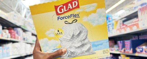 hand holding up a large box of Glad ForceFlex Trash Bags in store