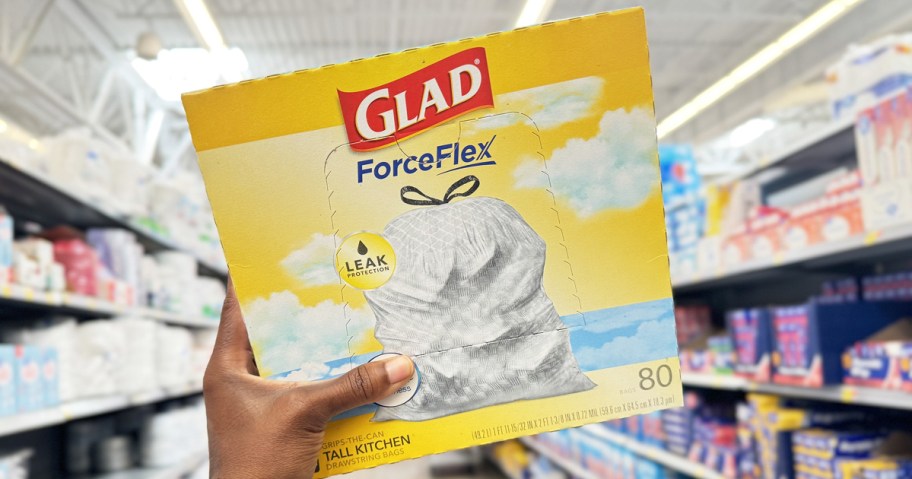 hand holding up a large box of Glad ForceFlex Trash Bags in store