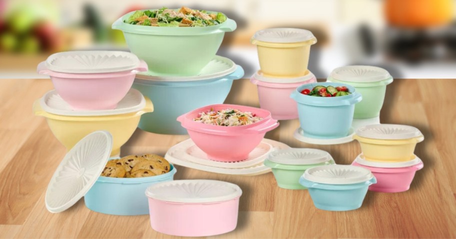 large set of Tupperware bowls and containers in light pastel colors