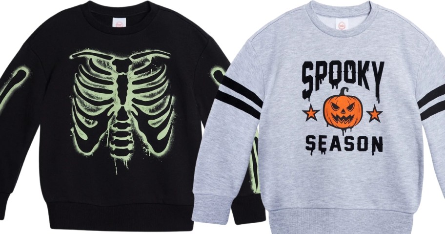 boys Halloween sweatshirts, 1 in black with glow in the dark skeleton bones and one in light grey with a jackolantern and "Spooky Season" on it