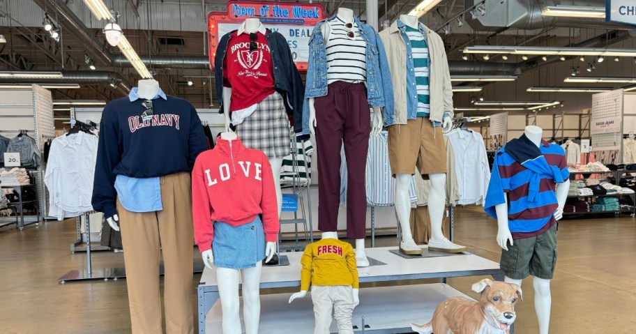 mannequin display at Old Navy with kids and adults clothing and dog