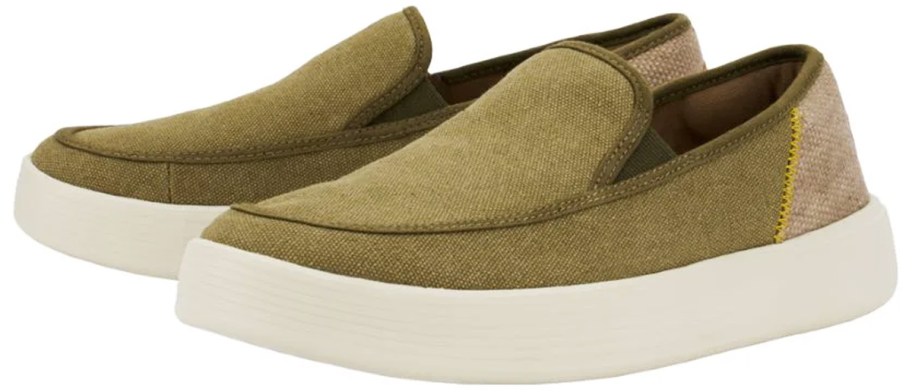 pair of olive green slip-on sneakers