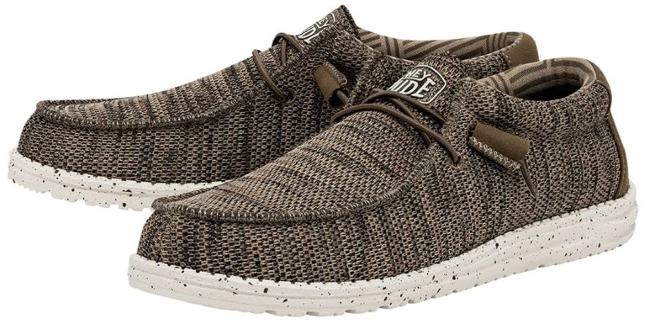 pair of brown knit heydude sneakers