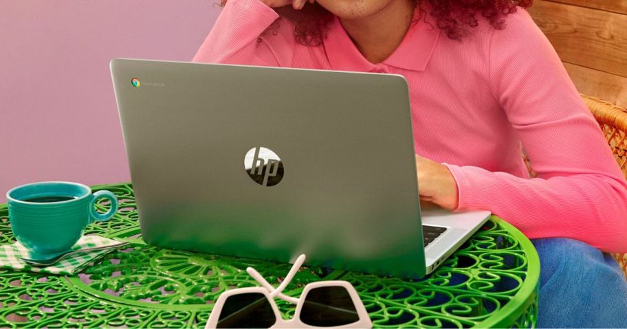 girl using HP 14" Chromebook Laptop