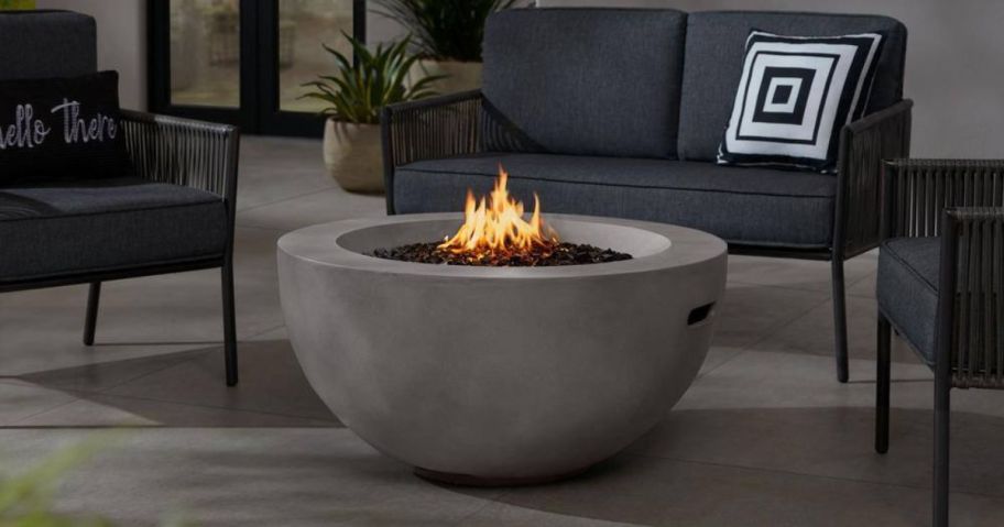 Hampton Bay Grove Park 36in x 18in Round Concrete Propane Gas Fire Pit on patio