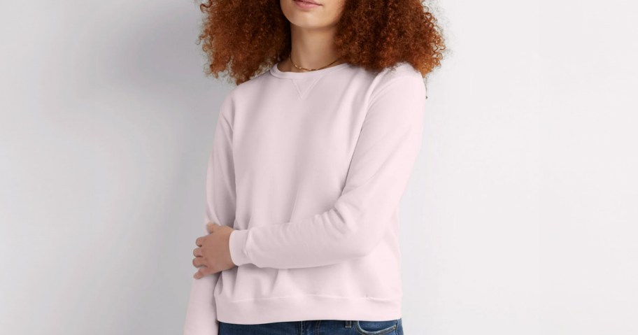 woman wearing Hanes Women's ComfortSoft EcoSmart Crewneck Sweatshirt