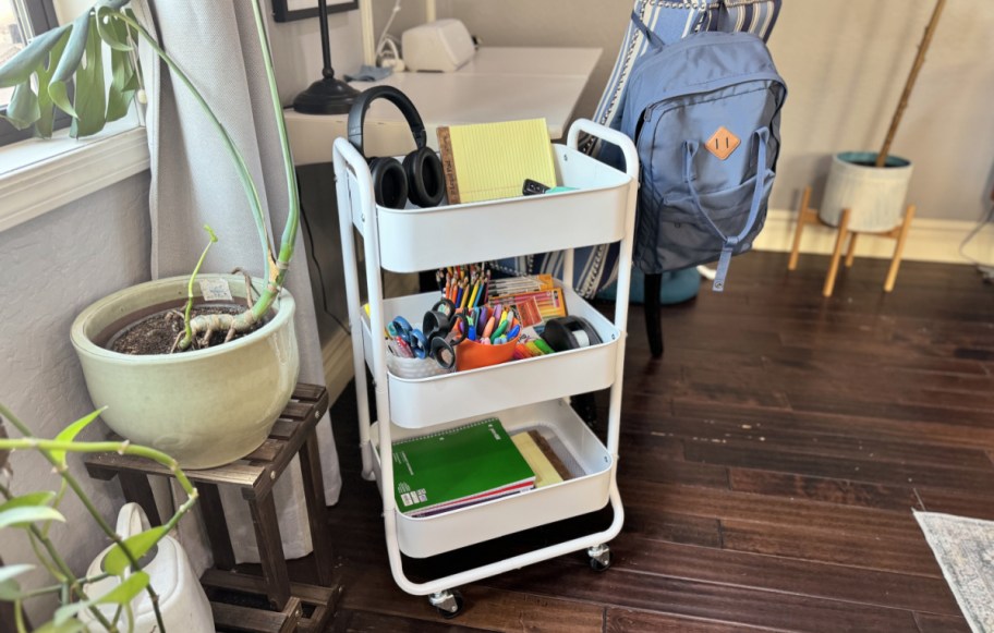 mainstays rolling storage cart filled with school supplies near a desk
