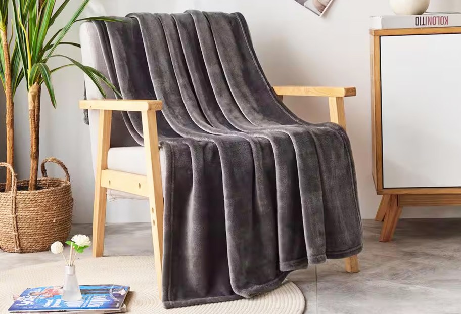 dark grey throw blanket draped over a chair