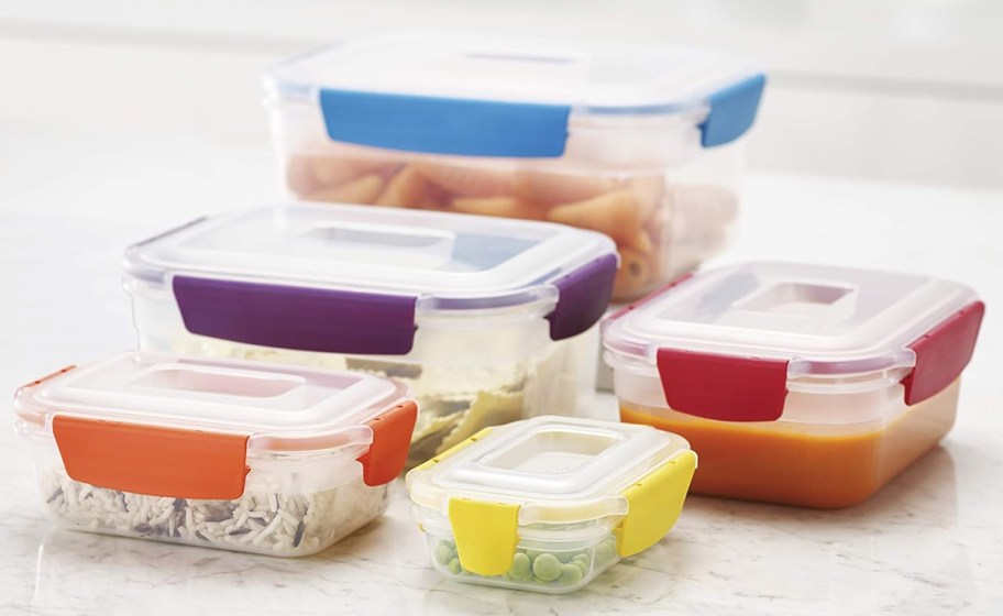 set of plastic food storage containers with colorful lids