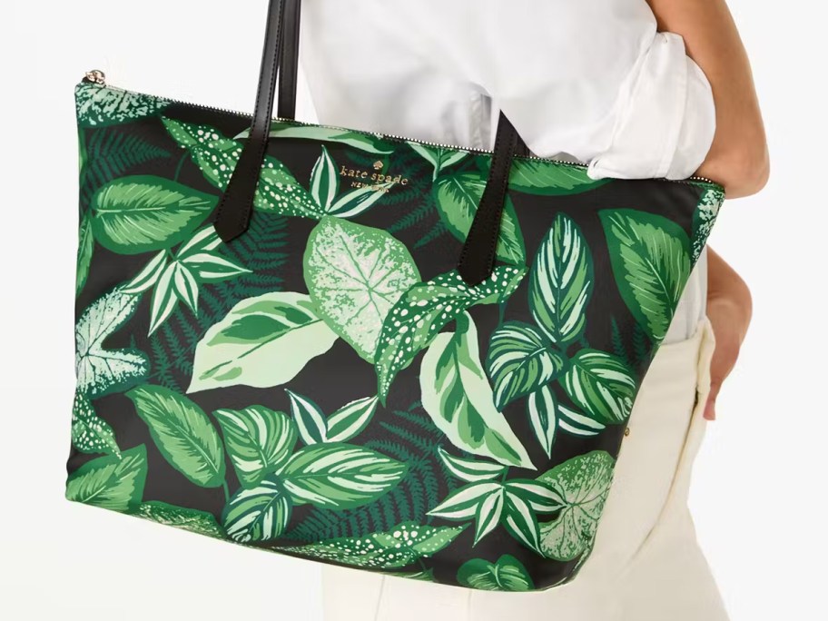 woman with a green leaf print tote bag