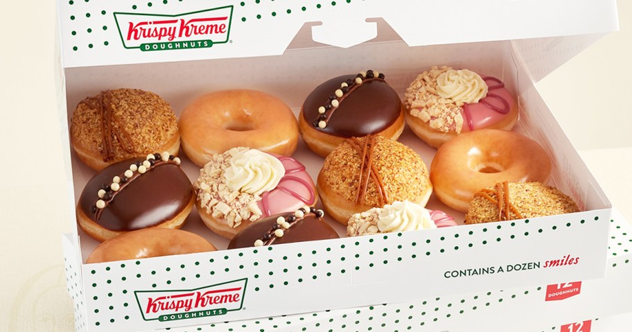 opened kispy kreme box with dozen doughnuts
