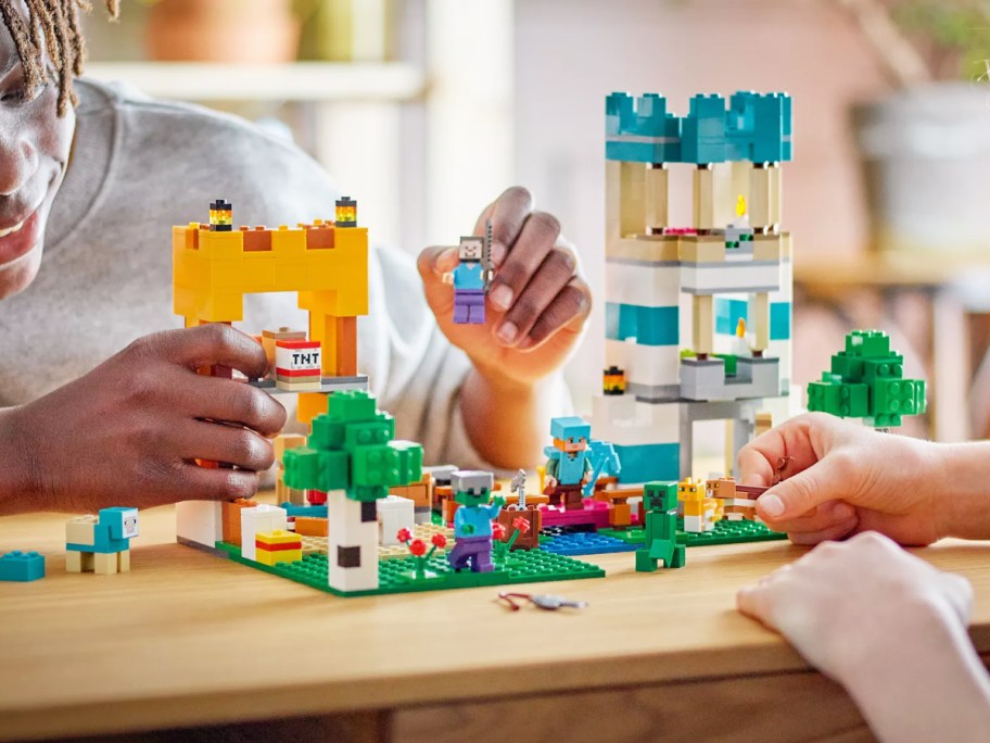 kids playing with lego minecraft set