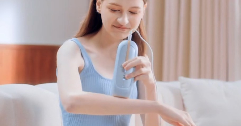 person using Lubex Cooling IPL Laser Hair Removal Device on arm