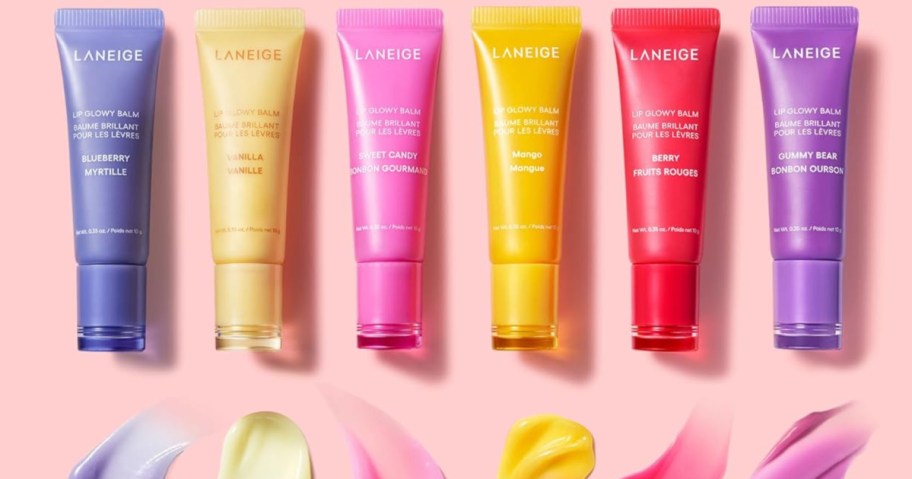 6 different Laneige Berry Glowy Lip Balms on pink background