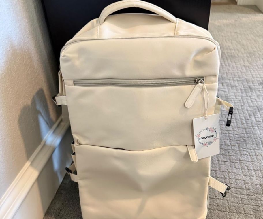 A travel backpack in a hotel room