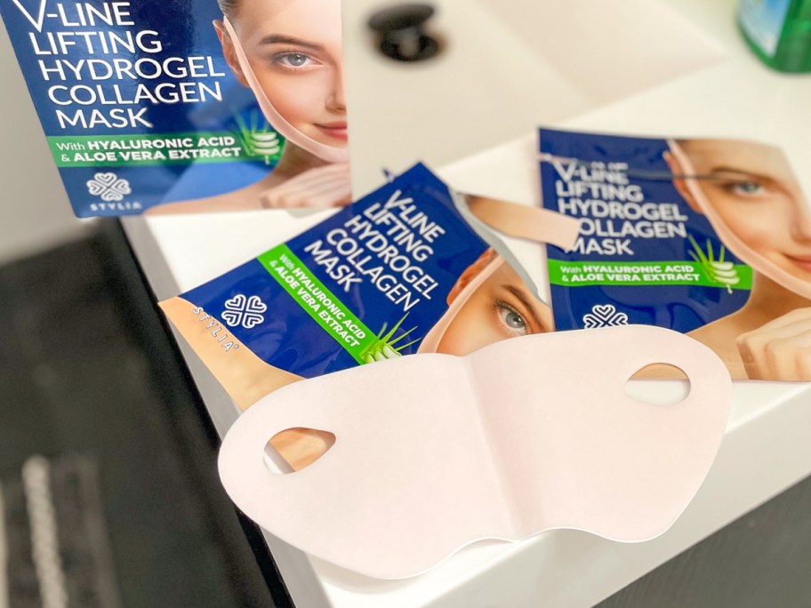 Lifting collagen chin masks displayed on the bathroom counter